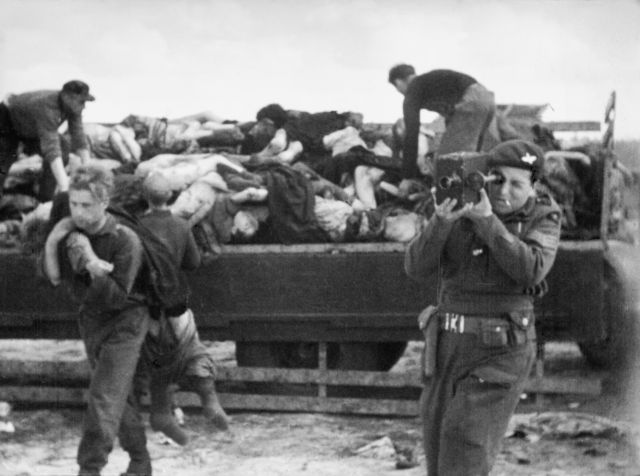 Army Film and Photographic Unit cameraman filming at Bergen-Belsen. Some of his footage appears in German Concentration Camps Factual Survey. IWM FILM 1232